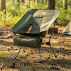Green camping chair with storage bag on a forest background - offered by the best outdoor gear store in Pennsylvania, The Adirondack Tool Co.