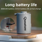 Qunature electronic air pump with charging cable on a wooden surface, text about battery life and charging - offered by the best camping gear store in New York, The ADK Tool Co.