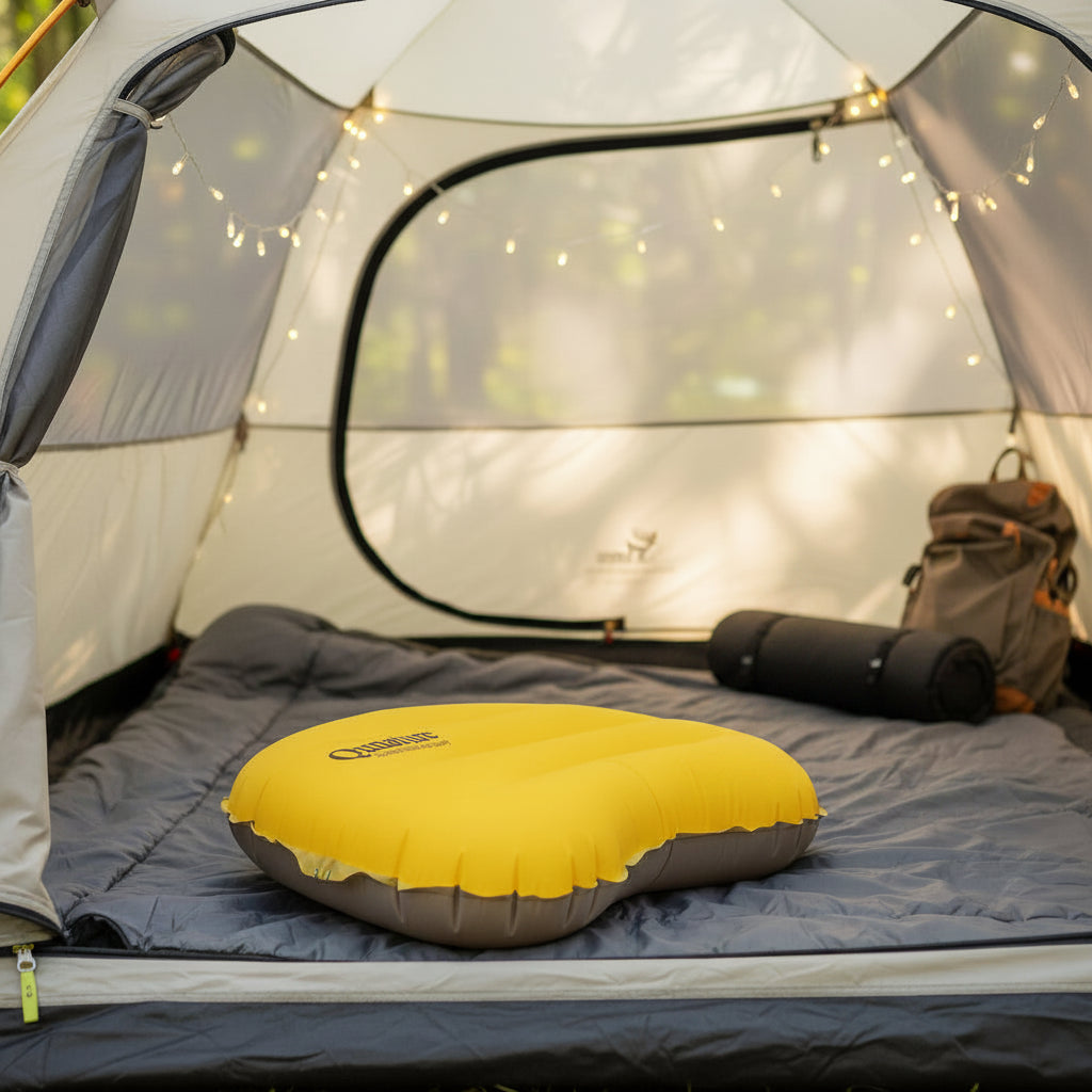 Yellow inflatable pillow with Qunature branding inside a camping tent - offered by the best camping gear store in New York, The ADK Tool Co.
