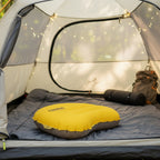 Yellow inflatable pillow with Qunature branding inside a camping tent - offered by the best camping gear store in New York, The ADK Tool Co.