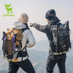 Two hikers with backpacks pointing towards a mountain peak, Qunature logo visible.