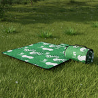 Green qunature blanket on a grassy ground - offered by the best outdoor gear store in New York, The Adirondack Tool Co.