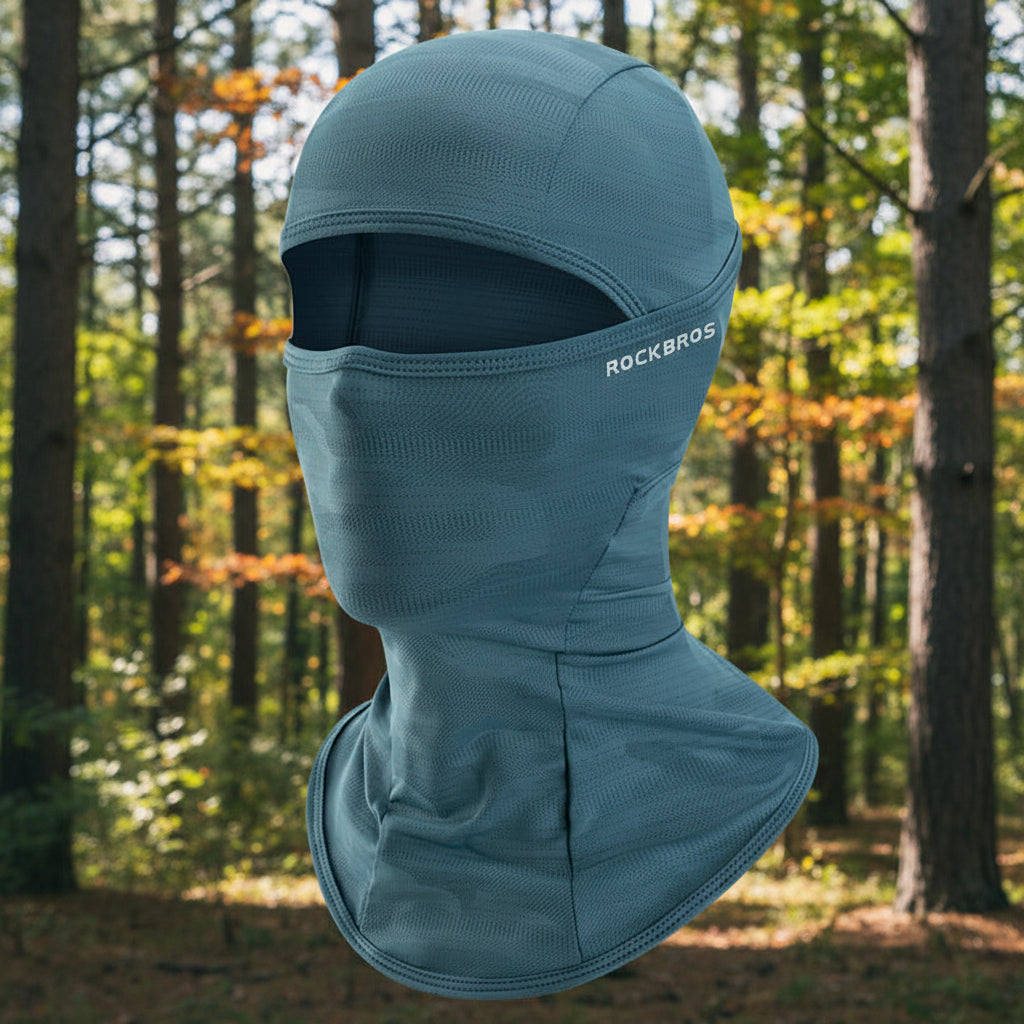 Teal camouflage balaclava on an outdoor background - offered by the best hiking gear store in the northeast, The Adirondack Tool Co.