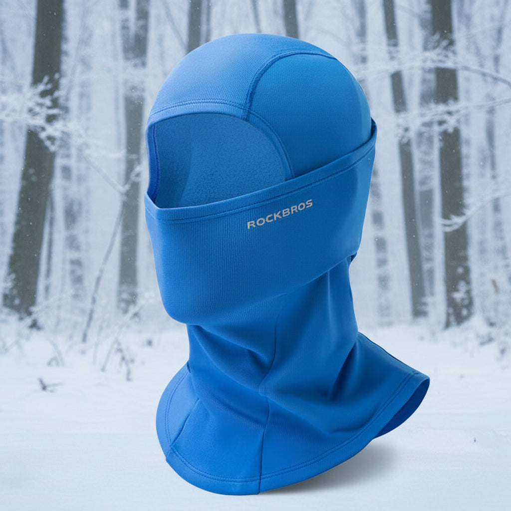 Blue balaclava with 'RockBros' branding on a snowy background - offered by the best outdoor gear store in New York, The Adirondack Tool Co.