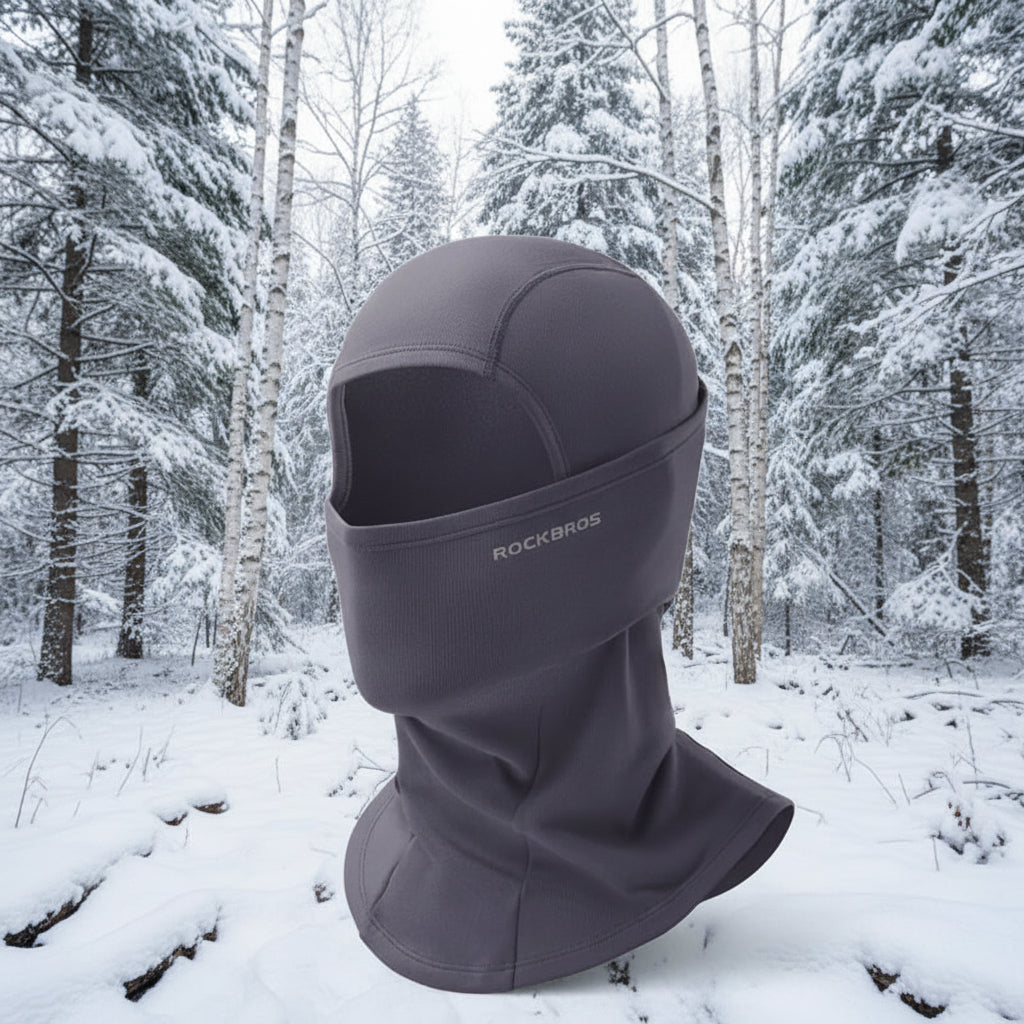 Gray balaclava with 'RockBros' branding on a snowy background - offered by the best outdoor gear store in New York, The Adirondack Tool Co.