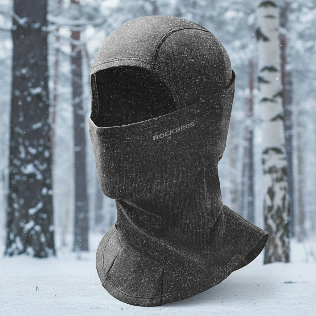 Black balaclava with 'RockBros' branding on a snowy background - offered by the best outdoor gear store in New York, The Adirondack Tool Co.