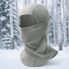 Gray balaclava with 'RockBros' branding on a snowy forest background - offered by the best climbing gear store in the United States, The Adirondack Tool Co.