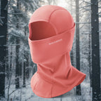 Pink balaclava with 'RockBros' branding on a snowy background - offered by the best outdoor gear store in New York, The Adirondack Tool Co.