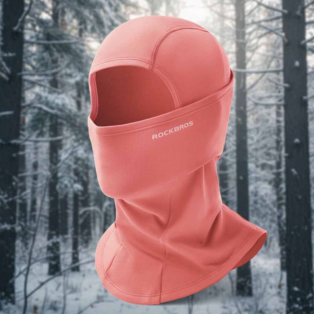 Pink balaclava with 'RockBros' branding on a snowy background - offered by the best outdoor gear store in New York, The Adirondack Tool Co.